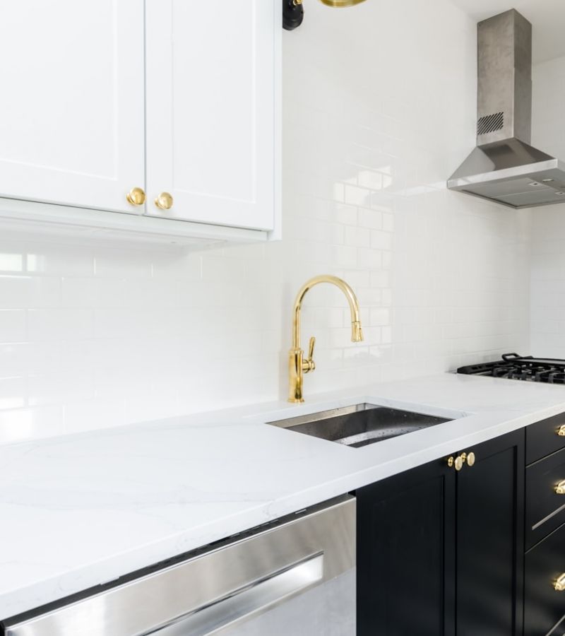 white wooden kitchen cabinet near white wooden kitchen cabinet