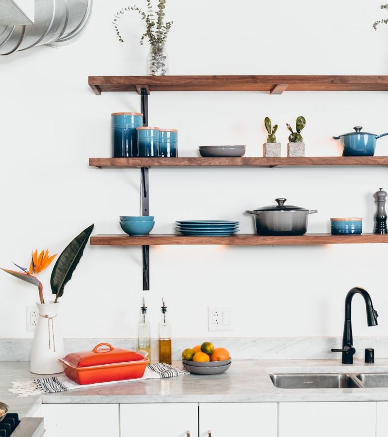 blue ceramic dinnerware on rack