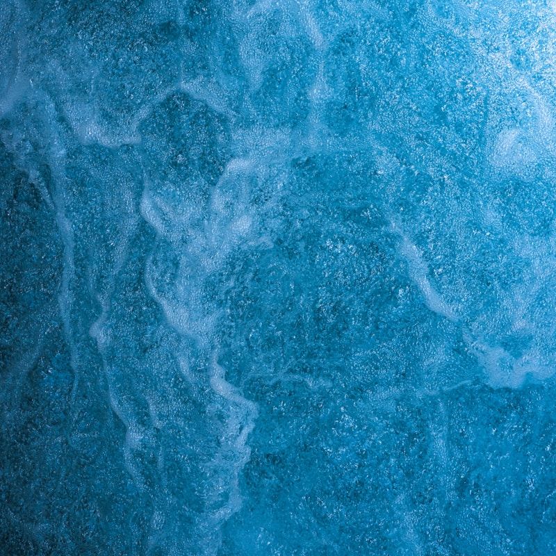 a close up of a blue water surface